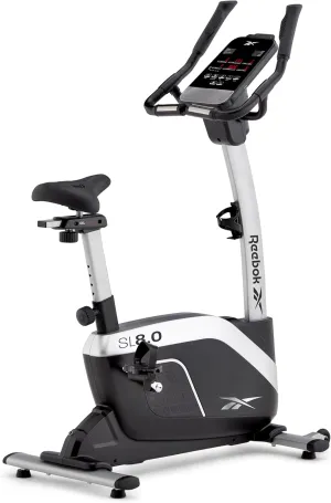 Reebok Fitness Stationary Bike: Bluetooth Compatible Indoor Cycling Bike, 24 Resistance Levels, 12 Workouts, Upright Exercise Bike with Gel Pad Saddle
